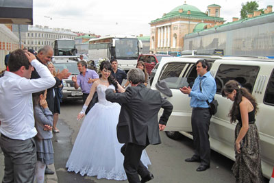 A Russian bride and her father celebrating in St. Petersburg. Photo: Bahde