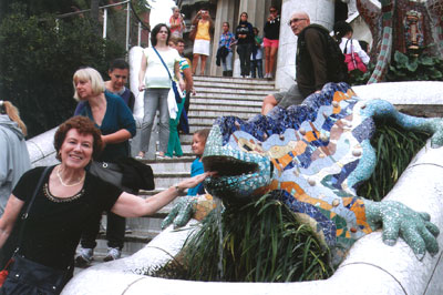 Arlene Lichtenstein tempting the Gaudí lizard in Parc Güell — Barcelona.