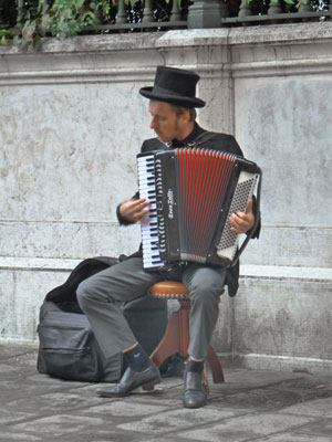 A musician entertains passersby.