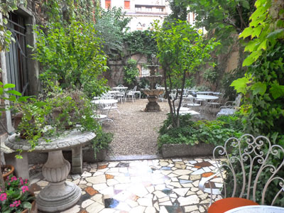 The lush courtyard at Hotel Flora.