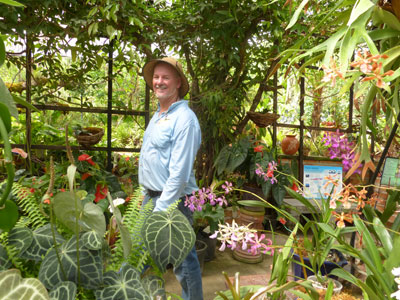 Bob Price, founder and curator of the Vallarta Botanical Gardens, strolls among orchids on display. 