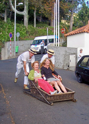 A wood-and-wicker sledge in full flight from Monte to Livramento.
