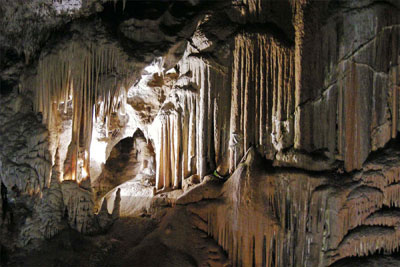 A recess off Postojna Cave’s walkway is filled with what appear to be icicles transformed into stone. Photo: Patten