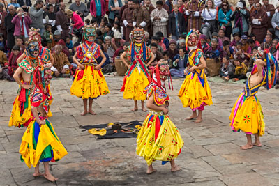Dancers performing at a festival at Jambay Lhakhang Temple.