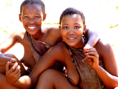Best friends, members of the San tribe, smiling for the camera. 