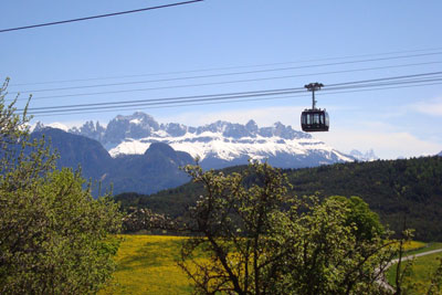 Renon/Ritten gondola above Bolzano, with the Dolomites in the background. Photo by Marilyn Hill