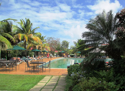 Coco Palm hotel, where the pool forms the heart of guest activity.