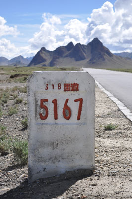 In Tibet, this marker on the China National Highway No. 318 indicates that it is 5,167 kilometers from Shanghai. We had passed Tingri 47 kilometers earlier and were heading toward the Nepal border. Photo by Emmy Allgood