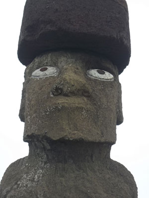 A moai, complete with top knot and restored eyes, at Tahai, Rapa Nui National Park.