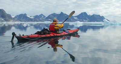 Kayaking in Greenland’s Ammassalik Fjord. Photo by Olaf Malver for Natural Habitat Adventures