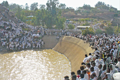 The blessing of the water at a reservoir at Axum attracted a huge crowd of Ethiopian Christians. Photo by David J. Patten