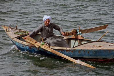 A fisherman on the Nile. (Note the homemade oars.)