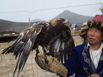 A proud Kazakh with his golden eagle. The eagle will be released back into the wild at four years of age. Photo by Rod Smith