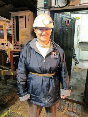 Elaine Kuzma in miner’s gear at Big Pit National Coal Museum — Wales. Photo by Joanne Kuzma