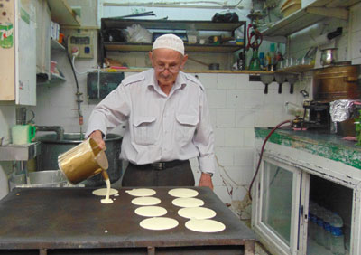 A vendor making Armenian pancakes, which we just had to sample!