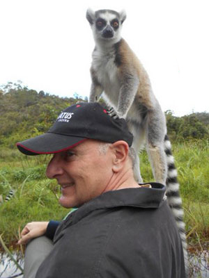 Tom Johanneck and a ring-tailed lemur — Vakôna Forest Lodge, Lemur Island, Madagascar.