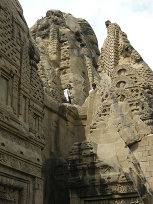 Visitors walking on the ruined temple towers of Masrur. Photo by David J. Patten