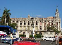 Classic autos compete for attention with the Gran Teatro de la Habana on the Paseo del Prado. Photo: Keck