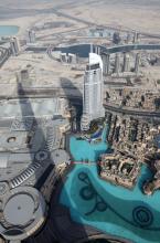 View of a man-made lake and the hotel The Address Downtown Dubai from Burj Khalifa in Dubai, UAE.