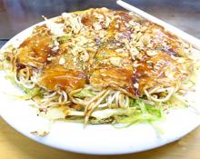A plate of okonomiyaki.