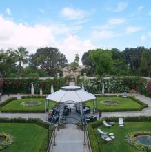 Ornate wrought-iron gates lead to the less-formal second garden.