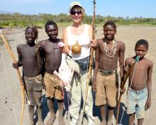 Suzi Colman shows off the flamingo found on her outing with the Hadza huntsmen.