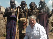 Larry Kritcher with members of the Mursi tribe.
