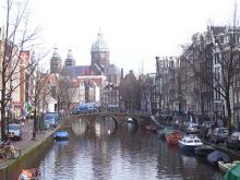 A view of a typical Amsterdam canal looking toward St. Nicholas Church.