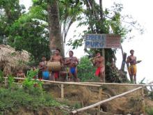 A small band of Emberá men singing and playing instruments made by hand