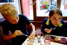 Travelers of all ages — here trying snails for the first time — can reach new gastronomic heights in France. Photo by Rick Steves