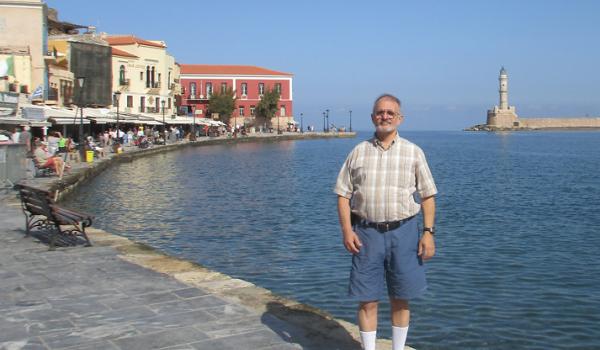 Marvin Feldman on the promenade at the Old Venetian Harbor in Chania, Crete. Photo by Carole Feldman