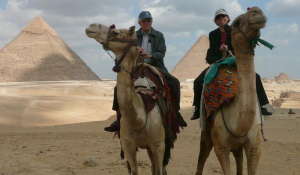 Riding camels to the Great Pyramids.