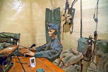 A mannequin holding 1940s communication gear sits inside Fortress Furigen, a decommis-sioned bunker near Luzern that provides a peek at Switzerland’s hidden defense system.