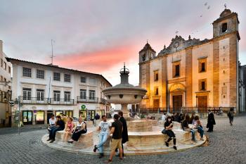 The 16th-century marble fountain, on Evora’s main square, was once an important water source. Now it’s a popular hangout for young and old. Photo by Cameron Hewitt