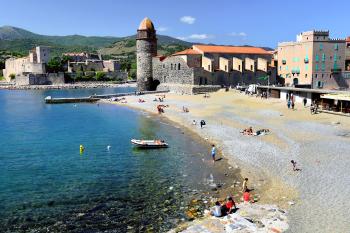 Collioure’s sand-and-pebble beach ends at the Notre-Dame des Anges church, a view that has inspired many modern artists. Photo by Cameron Hewitt