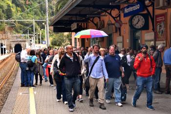Tour groups can crowd Cinque Terre train platforms in peak season. Photo by Cameron Hewitt