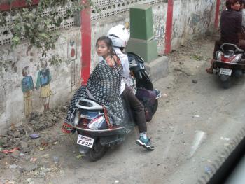 Couple on a motorcycle in Agra, India.