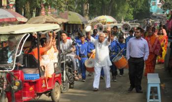 Wedding procession heading from the town of Mayapur to a branch of the Ganges.
