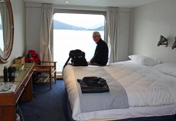 Ray Bahde relaxing in our cabin on the <i>Ventus Australis</i>. Photo by Wanda Bahde