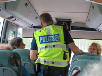 Authorities checked group members' travel documents at the Latvia/Estonia border crossing. Photo by Bonnie Carpenter