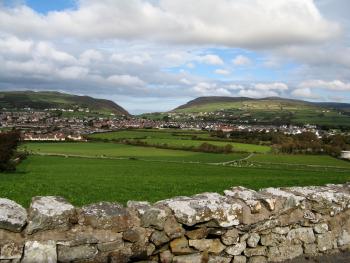 Suburban homes near Port St. Mary spread across a picturesque valley.
