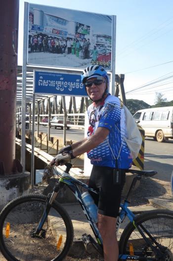 Jay Jacobson about to cross the Mekong River on a bridge in Cambodia.