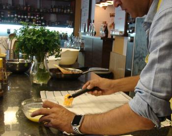 Brushing butter on the phyllo pastry.