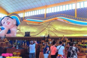 The gold-plated Reclining Buddha is 33 meters loåçng — Penang. Photo by Robert Siebert