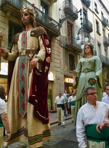 A celebratory parade featuring los gigantes during La Mercè, the festival of festivals in Barcelona.