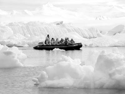 A Zodiac cruises through the ice off Petermann Island.