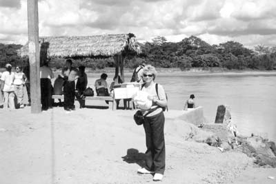 Pat Arrigoni gets ready to board the launch on the Tambopata River for the first of three boat rides heading for Sandoval Lake Lodge.