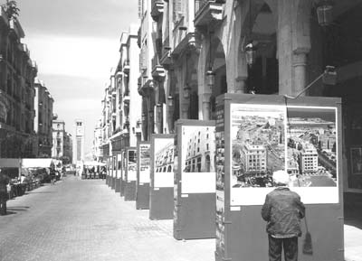 Posters show the before and after views of bombing damage in Beirut.