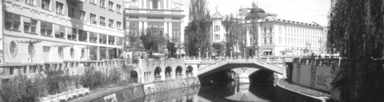 The Triple Bridge crosses a peaceful Ljubljanica River.