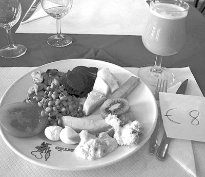 A salad and drink make a tasty lunch in Spain for €8 (under $10). 